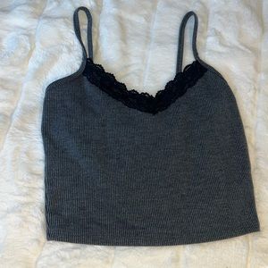Super cute black crop top with lace on top.